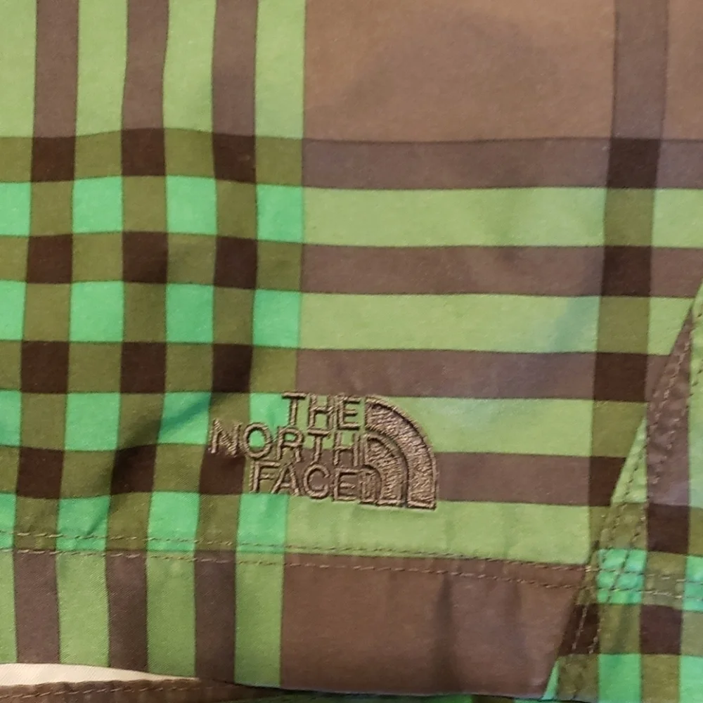 The north face green and gray lined swim trunks